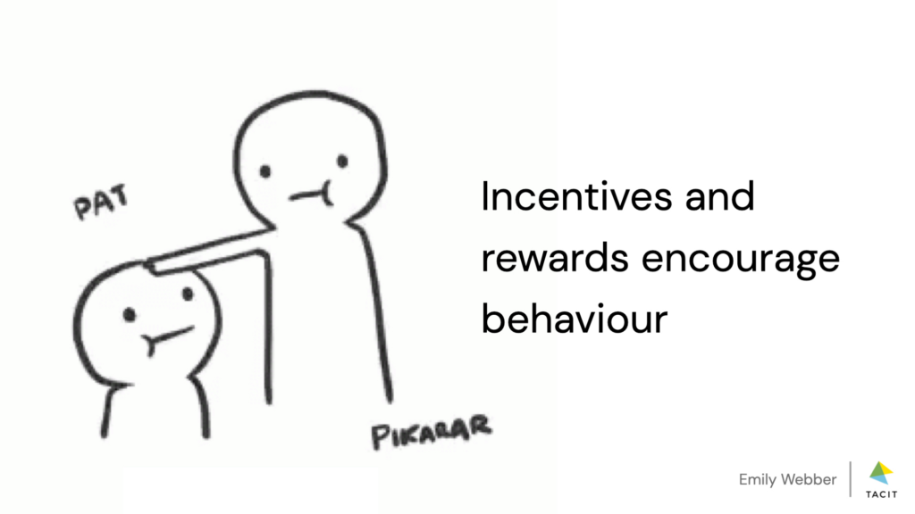Slide with one cartoon figure patting another one on the head, and caption: "Incentives and rewards encourage behaviour"