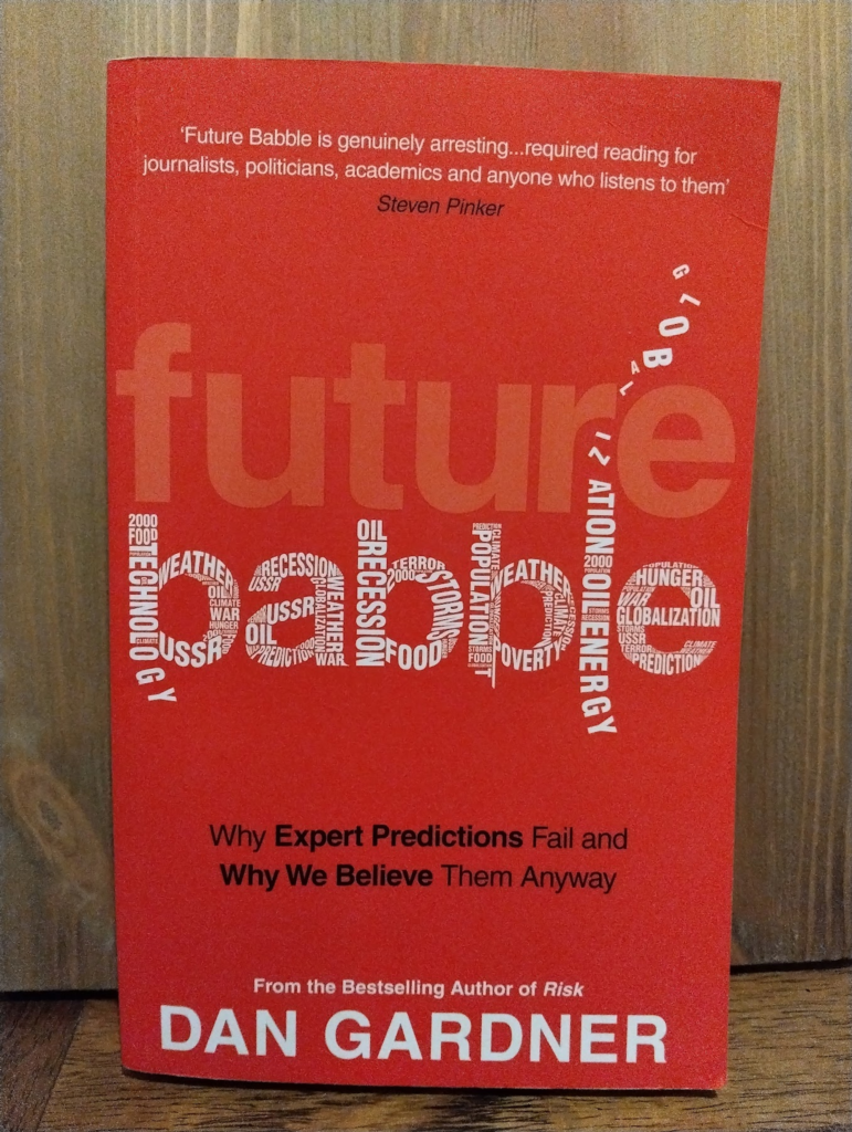 Photo of the book. It's. a red cover, with a pale red "future" and while "babble" made up of lots of other words like technology, oil, weather. 

Quote at the top: "Future babble is genuinely arresting ... required reading for journalists, politicians, academics and anyone who listens to them" (Steven Pinker)