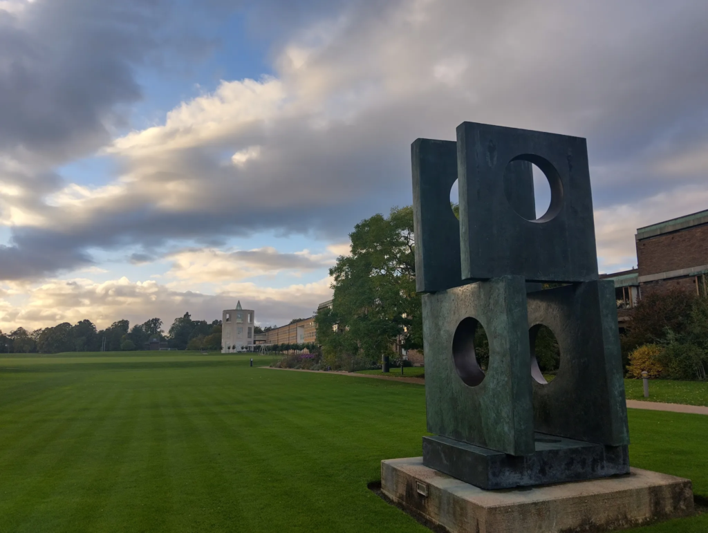 Photo of a sculpture: 4 large square blocks, with a circular hole in each. Link in the caption has a full description.