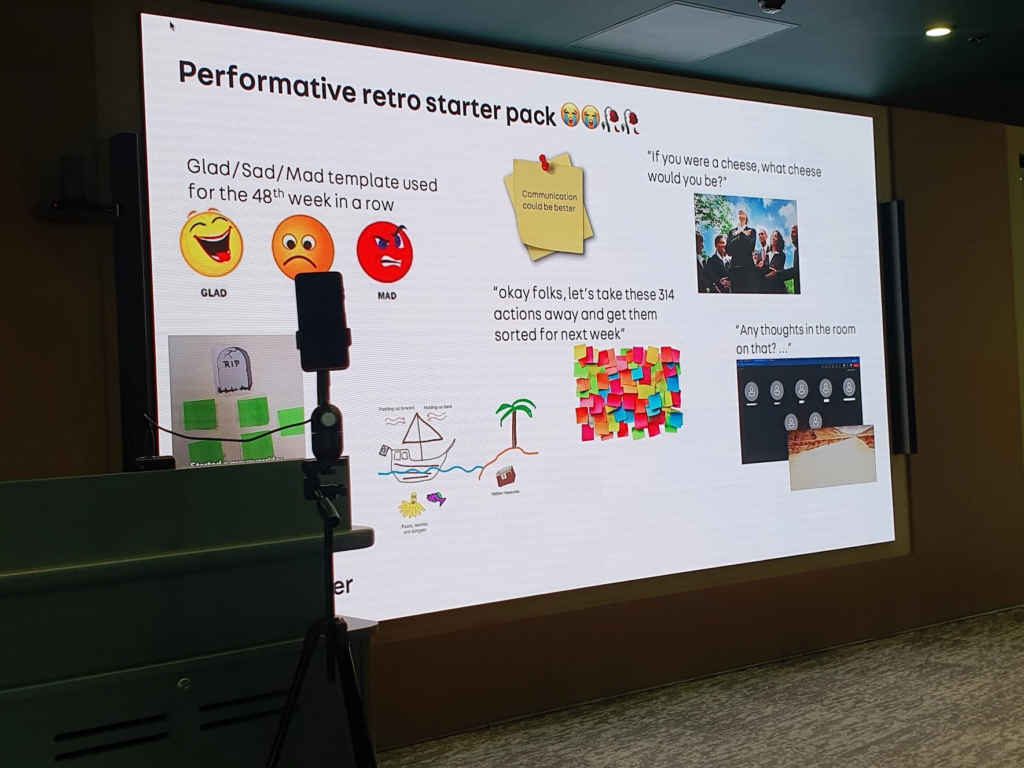 Slide showing a "performative retro starter pack", including:
"Glad, sad, mad template used for the 48th week in a row"
"Okay folks, let's take these 314 actions away and get them sorted for next week"
"If you were a cheese, what cheese would you be?"
"Any thoughts in the room on that?..." to a screen full of cameras off and on mute.